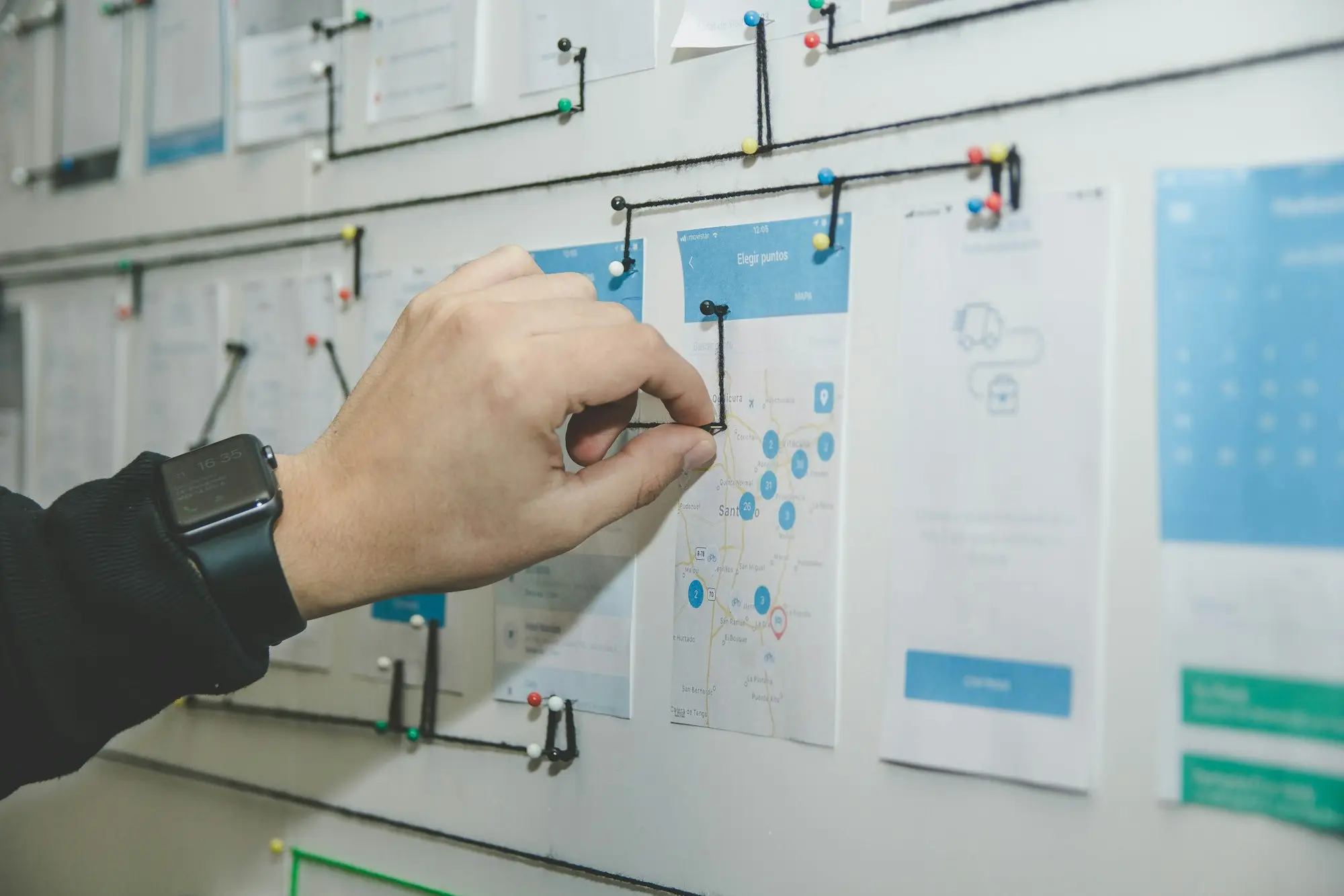 Business owner mapping a growth plan on a whiteboard