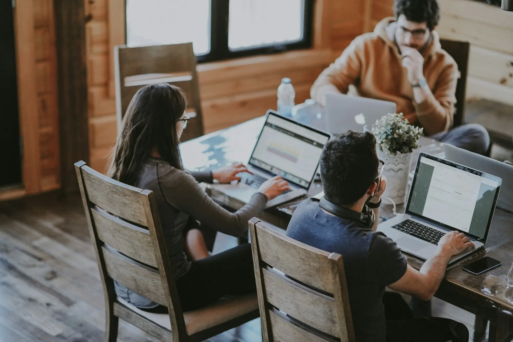 Small business team planning around a table in a bright Melbourne office